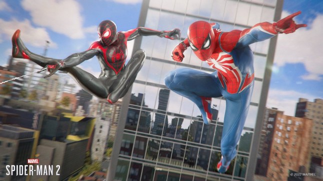 Two Spider-Man swinging through city